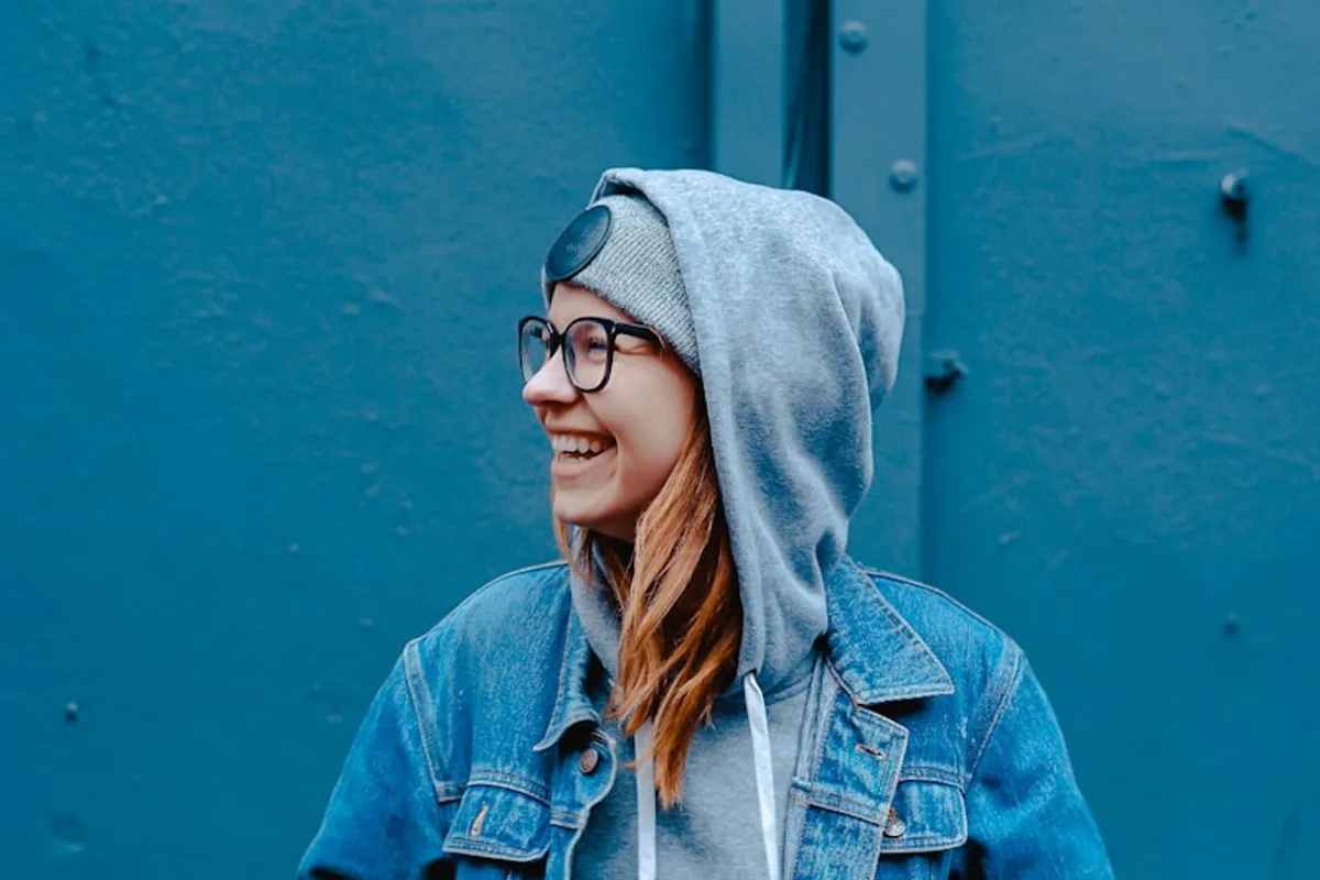 Portrait against a blue background with open space for a thoughtful crop