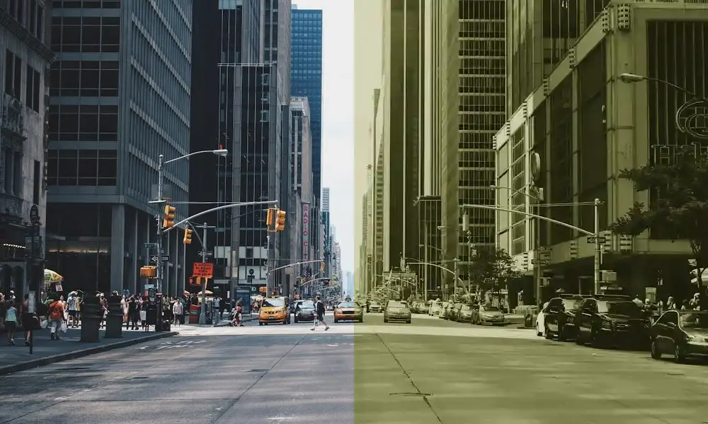 A clear city street transitioning into a pixelated, compressed old-device image